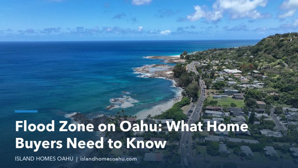 Aerial view of blue water, the coastline and homes at the foot of a hill, illustrating a flood zone on Oahu